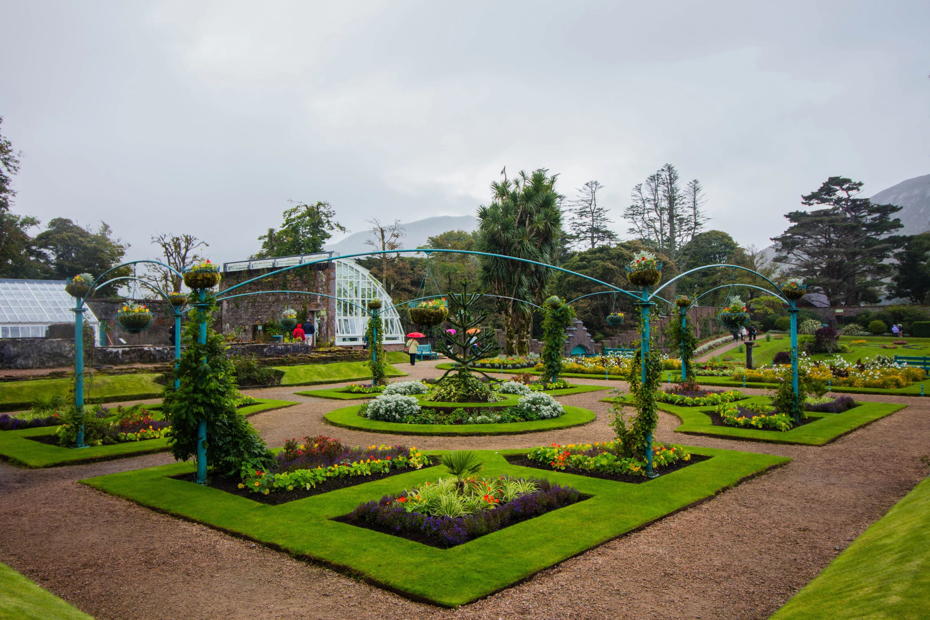 Planted garden beds of the kind the store furnishes and decorates. The product context: garden furniture, planters and decorations sold across three stores